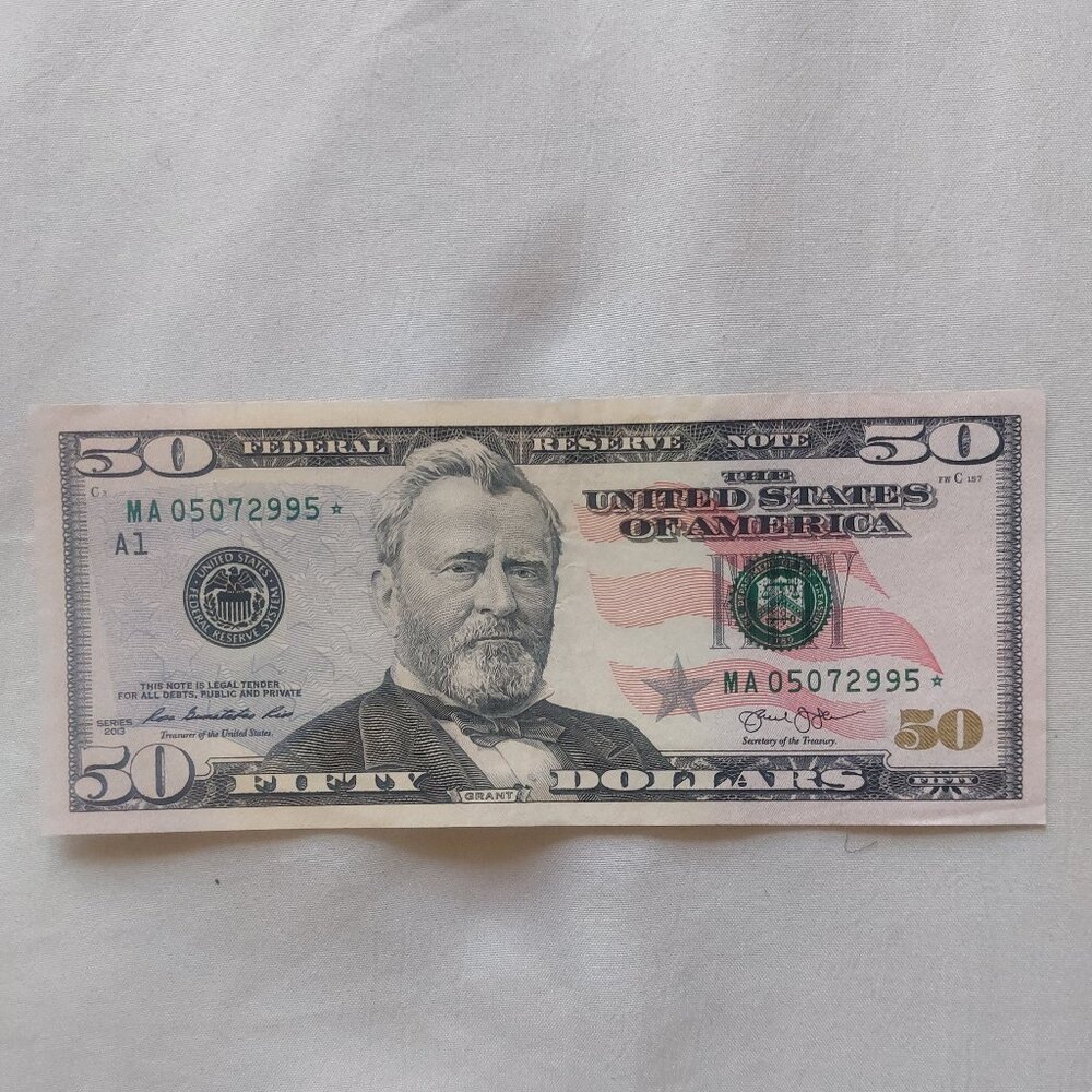 $50 dollar bill with star note